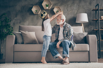 Profile photo of funny aged old grandpa golden crown head little pretty granddaughter playing...