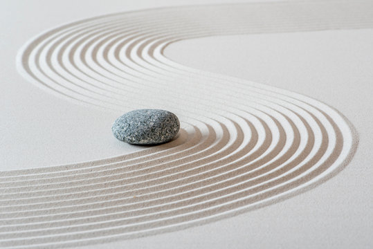 japanese garden with stone in textured sand