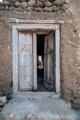 Fototapeta na wymiar old houses wooden windows and doors in Taqah, Salalah, Oman