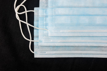 Background concept for news about the novel coronavirus COVID-19 pandemic, antiviral medical mask...