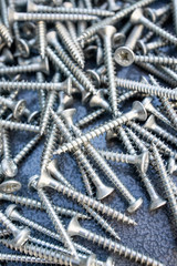 tapping screws made od steel, metal screw, iron screw, chrome screw, screws as a background, wood screw,