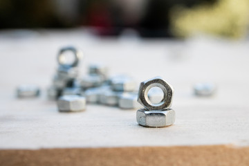 hex steel nut, industry background, stainless steel hex nut photo. industrial iron nuts nails and screw. Close-up of various steel nuts and bolts