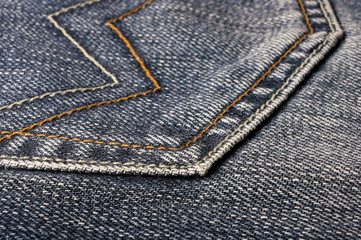 clothing items blue stonewashed faded jeans cotton fabric texture with seams, clasps, buttons and...