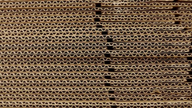 A stack of sheets of industrial packaging board. Cardboard Sheets for Boxes, copy space, industrial, carton, background