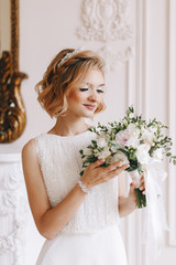 Portrait of the bride. Young girl, blonde with a short haircut. Close-up, vintage. Beautifully poses