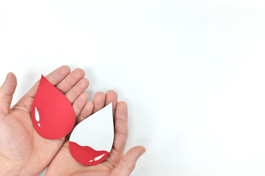 Male Hands Holding Blood Drop. Donation And Transfusion Concept. World Blood Donor Day.