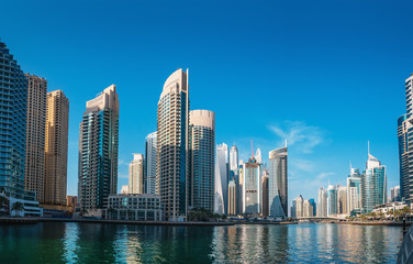 Fototapeta na wymiar Luxury Dubai Marina canal in Dubai with high buildings at background, United Arab Emirates.