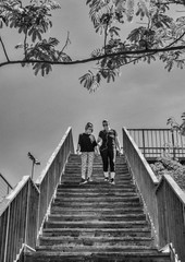 Obraz premium The Mother And Her 12-year-old Daughter Complying With The Schedules To Go For A Walk, Wearing A Mask Sanitary After The State Of Alarm. Covid-19 Bull Run Pandemic In Spain.