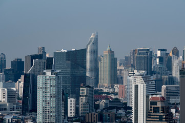 Fototapeta na wymiar Bangkok city view in day time as in blue tone for your city business background.