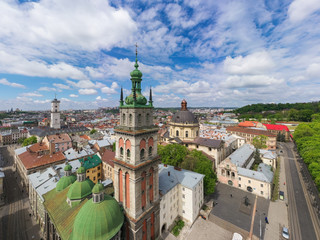 Obraz premium Aerial view on Dominican Church and Dormition Church in Lviv, Ukraine from drone
