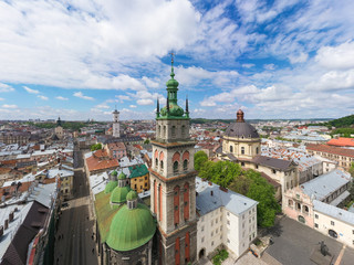 Obraz premium Aerial view on Dominican Church and Dormition Church in Lviv, Ukraine from drone
