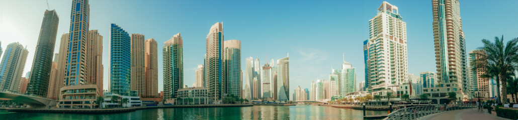 Fototapeta na wymiar Panorama of Dubai Marina skyline with many skyscrapers, United Arab Emirates.