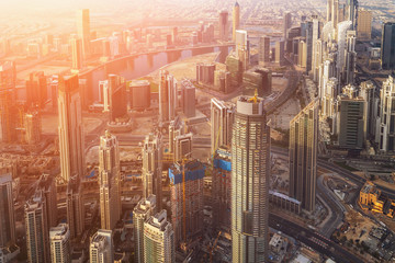 Dubai from above on sunrise. Dubai skyline and skyscraper tower buildings, United Arab Emirates.