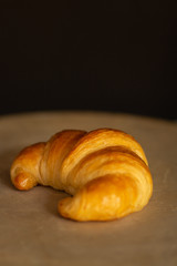 fresh croissant on a wooden table