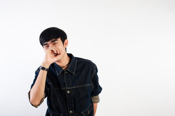 A smiling Thai man is smiling happily for life. For the surroundings Siamese smiles and optimism. The concept of happiness.