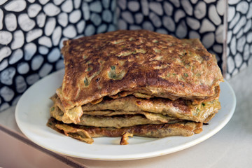 "Murtabak" or pancake with mixed meat or chicken and vegetable on the plate