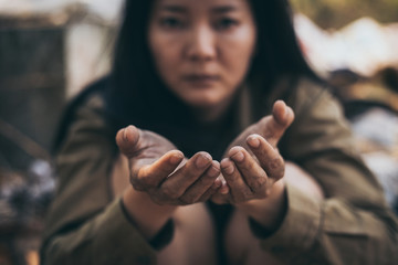 poor people,homeless or beggar begging for help sitting at dirty slum.concept for poverty...