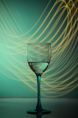 wine glass on a blue background with neon lights