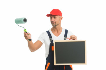Useful tips. Chalkboard copy space. Paint rolling. Decorator hold paint roller. Renewal and...