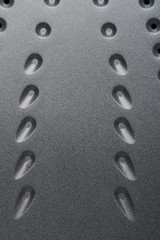 Dots on metal iron surface