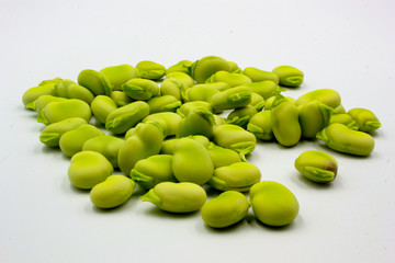 pile of fresh shelled broad beans isolated on a white background