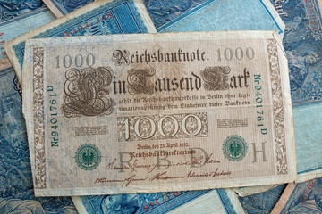some old historical German banknotes lie spread out on a table