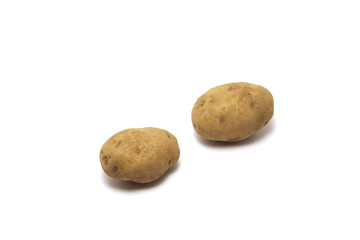 Fototapeta premium Two unpeeled potatoes (Solanum tuberosum) shot on top high angle isolated on white background