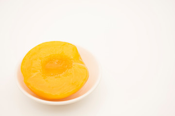Peaches in syrup and cut in halves.