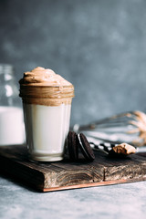 Dalgona coffee in a glass. Korean coffee and milk drink.