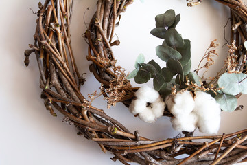handmade wreath made of twigs, eucalyptus and cotton