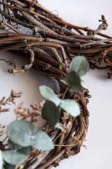 handmade wreath made of twigs, eucalyptus and cotton