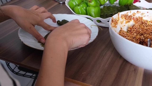 stuffing peppers with home mortar from mother's hands at home