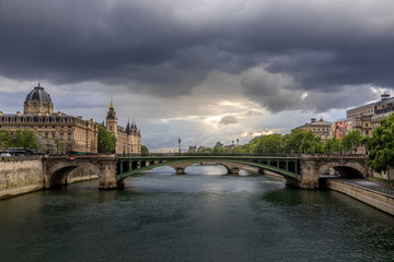 Fototapeta premium Paris, France - April 28, 2020: Panoramic view of the Conciergerie, the Hotel Dieu and the bridges over the Seine during the containment measures due to the coronavirus