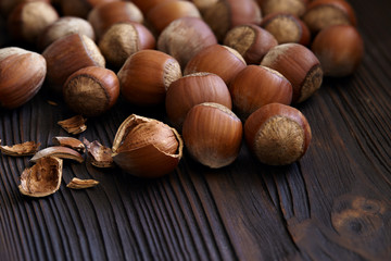 Hazelnuts close-up on a wooden background.