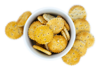 Portion of mixed Snacks isolated on white (close up shot; selective focus)
