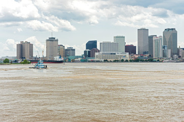 Ships in harbor and downtown new orleans skyline