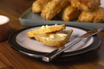 Cheese scones with butter close up