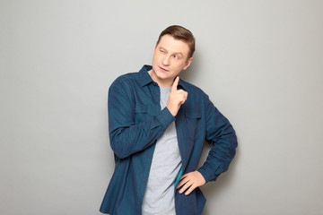 Portrait of focused positive mature man thinking and making choice