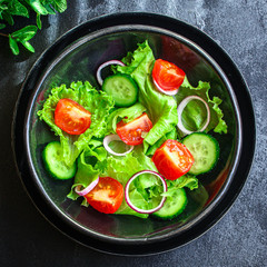 Healthy salad, leaves mix salad (mix micro greens, cucumber, tomato, onion, other ingredients). food background. copy space for text keto or paleo diet
