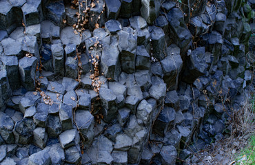 Nature background. Soft focus of geological structure, basalt columns