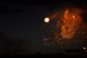 Colorful fireworks explosion on black background. Fireworks in the sky at night.