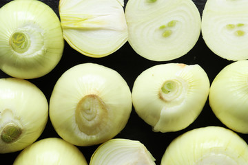 Photography of peeled and cut onions for food background
