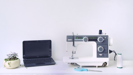 Computer, sewing machine, scissors. Online courses.