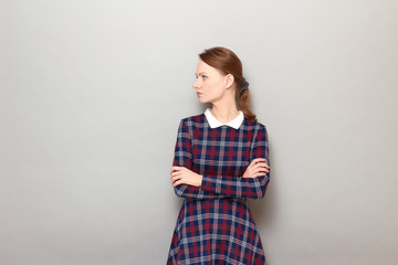 Portrait of serious focused annoyed girl crossing arms over body