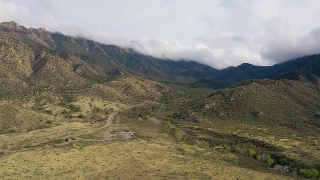 The Road Leading To Madera Canyon In The Santa Rita Mountains In Arizona, USA Surrounded In Green Nature. - aerial drone shot