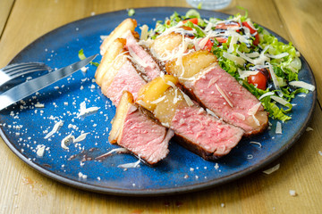 Grilled steak with salad on the side: