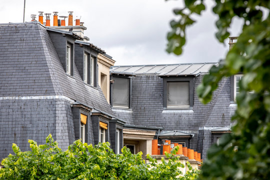 Paris, France - May 1, 2020: Typical roofs of haussmann buildings in Paris
