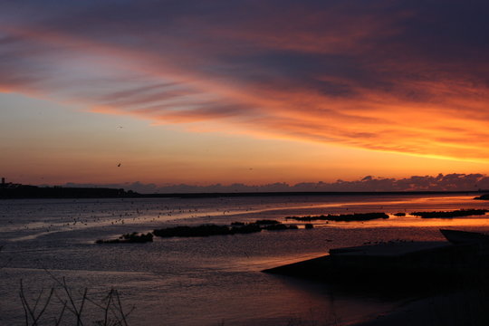 Sunset at the ocean, silhouettes, natural colors