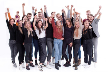 group of confident young people standing with their hands up