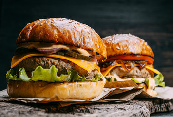 mouth-watering, delicious homemade burger used to chop beef. on the wooden table.